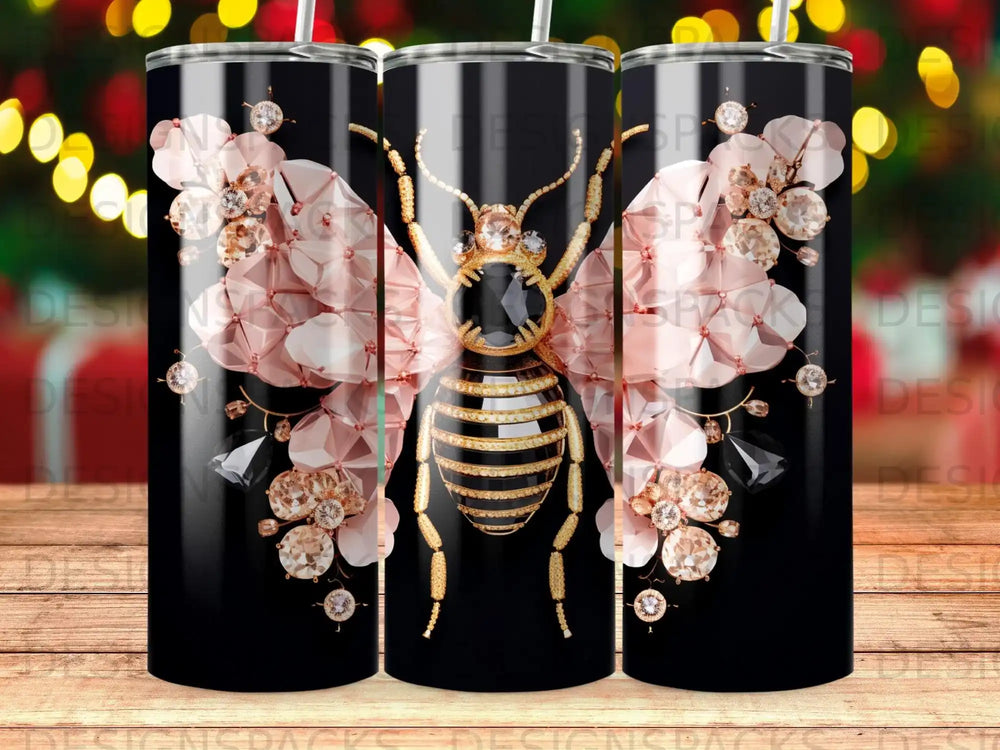 Black tumbler with gold and pink gem-encrusted bee and floral accents.
