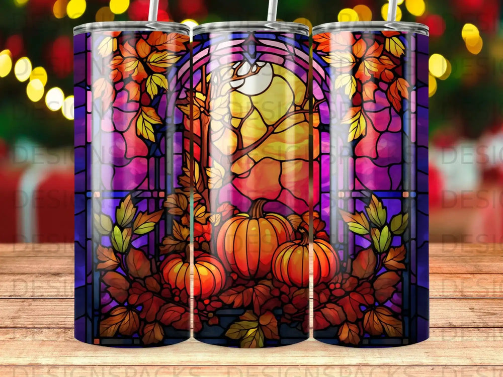 Stained glass tumbler featuring pumpkins and autumn leaves with a moon.