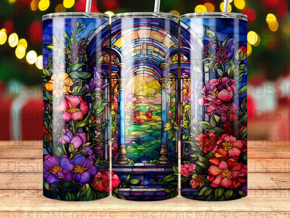 Stained glass window with floral border and outdoor scene.
