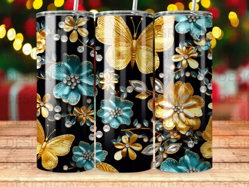Gold butterflies and teal flowers with gems on a black tumbler.