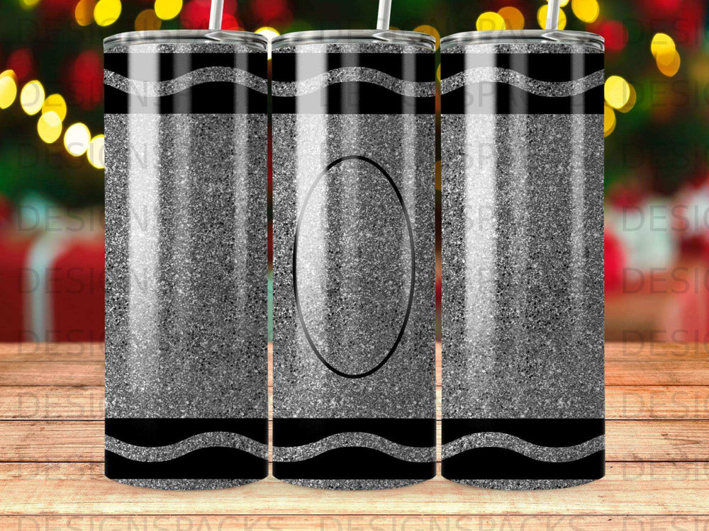 Glittery black and gray crayon design on a tumbler with a straw.