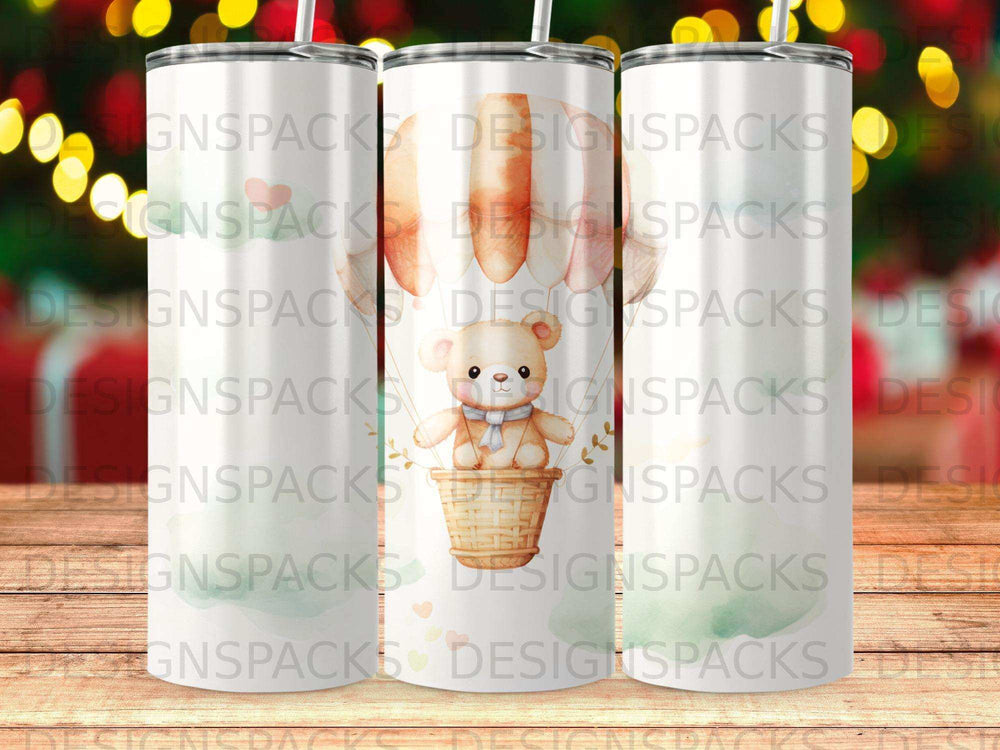 Teddy bear in hot air balloon on a skinny tumbler, light green background.