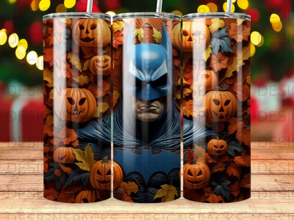 Batman on a tumbler surrounded by pumpkins and autumn leaves.