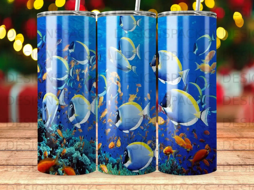 Blue and yellow fish swim amongst coral in an underwater scene.