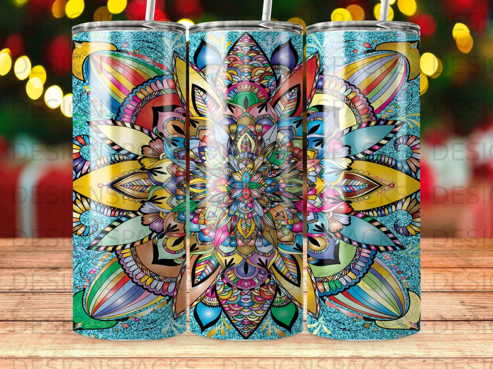 Three colorful mandala tumblers with glittery blue background.