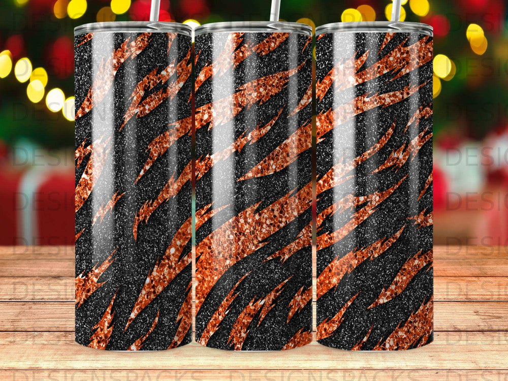 Tiger stripe tumbler with glitter accents and black background.
