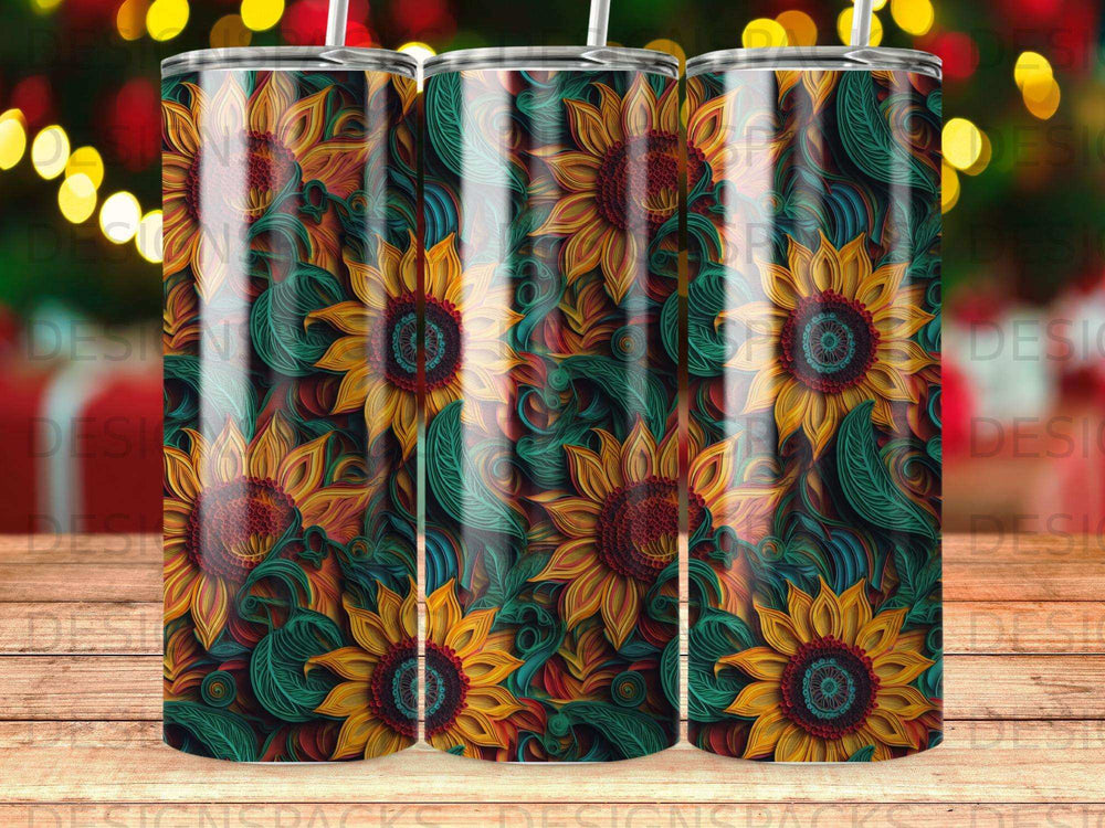 Three tumblers with a repeating sunflower and leaf pattern in red, yellow, and green.