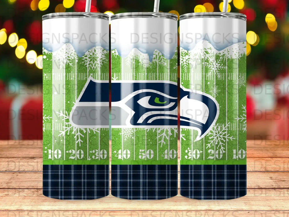 Seattle Seahawks logo on a football-themed tumbler with snowflakes and numbers.