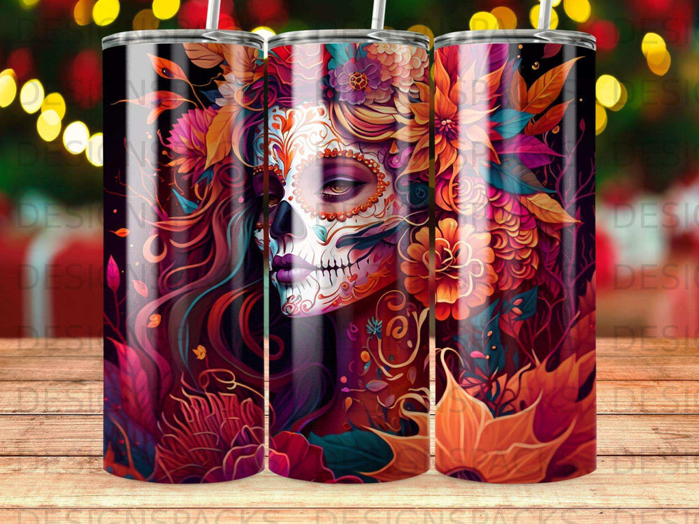 Sugar skull with floral accents and vibrant colors on a tumbler.