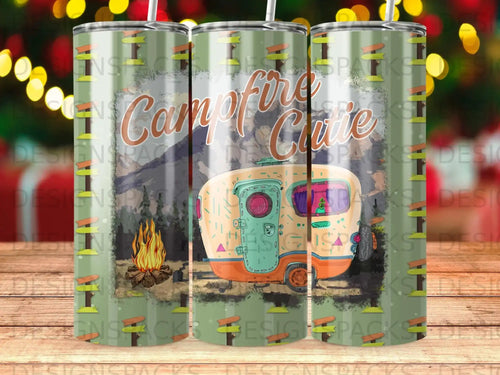 Campfire Cutie text on a vintage camper trailer with a campfire.