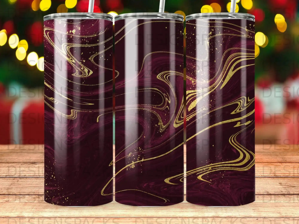 Marbled burgundy tumbler with flowing gold accents.