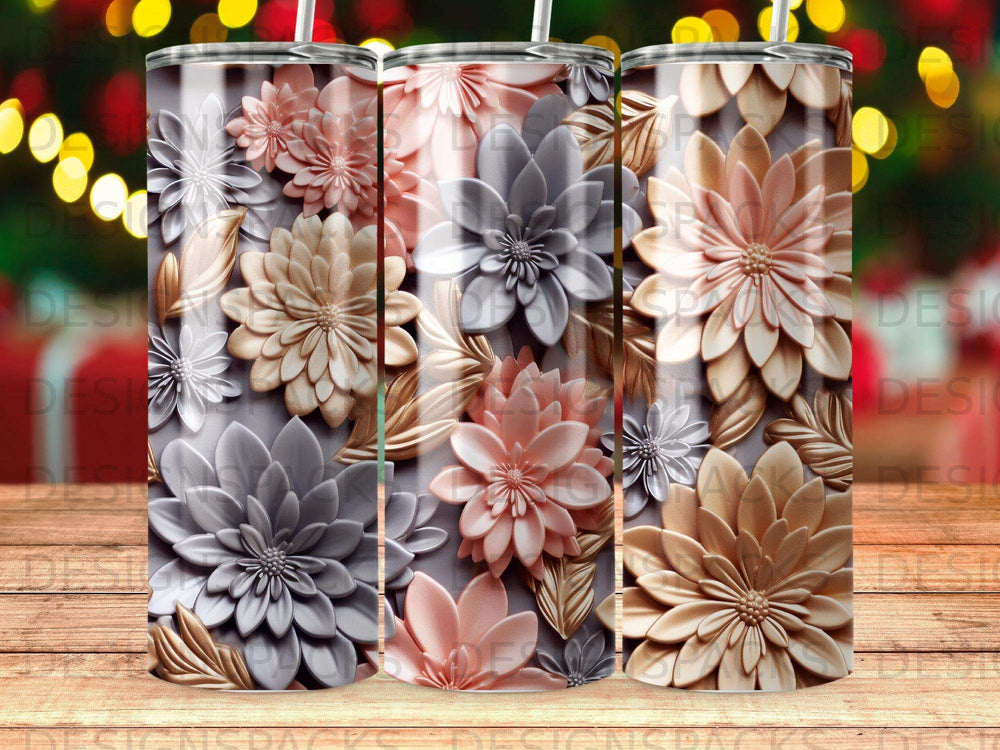 Three tumblers with 3D floral designs in gray, pink, and gold.