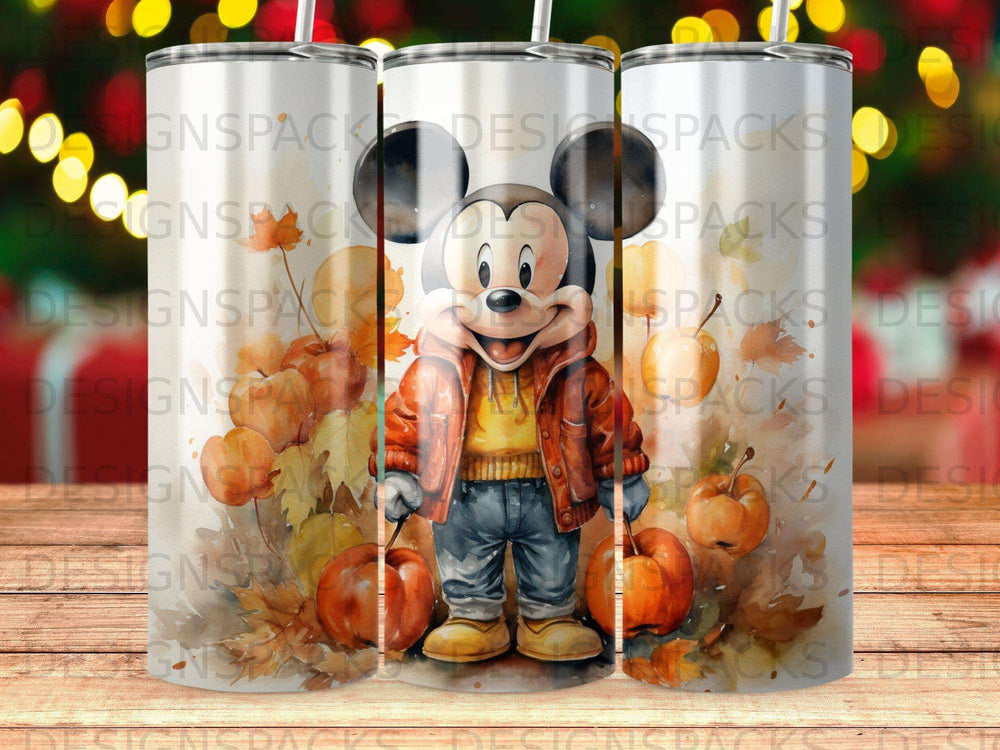 Mickey Mouse in autumn attire with pumpkins, "Designspack" watermark.