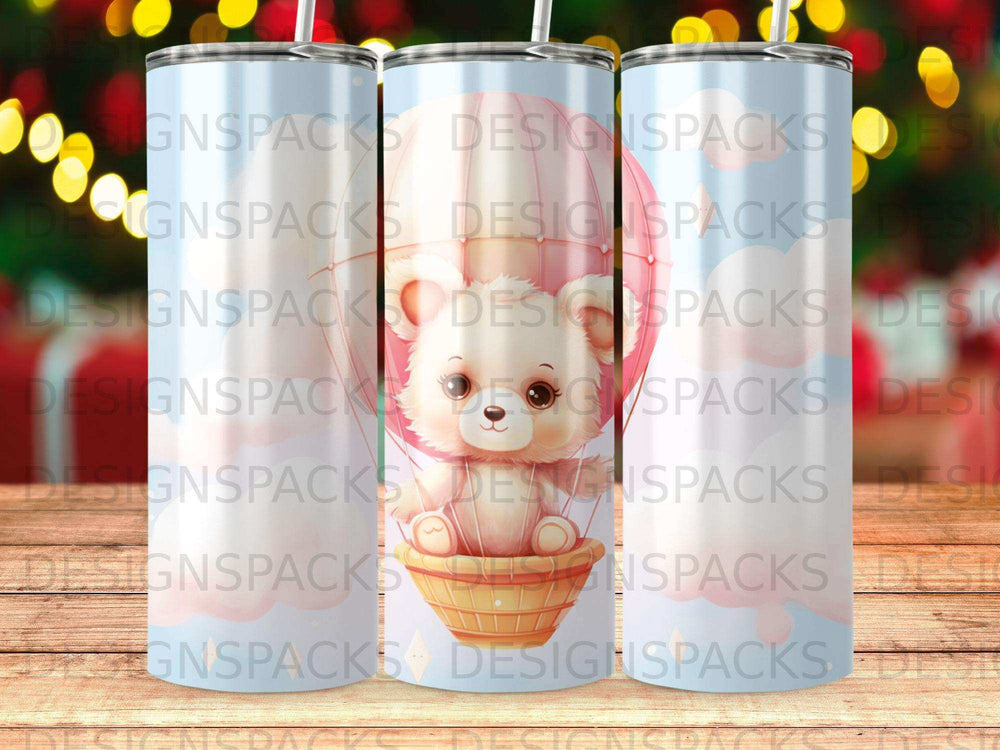 Pink hot air balloon with a teddy bear in a basket.