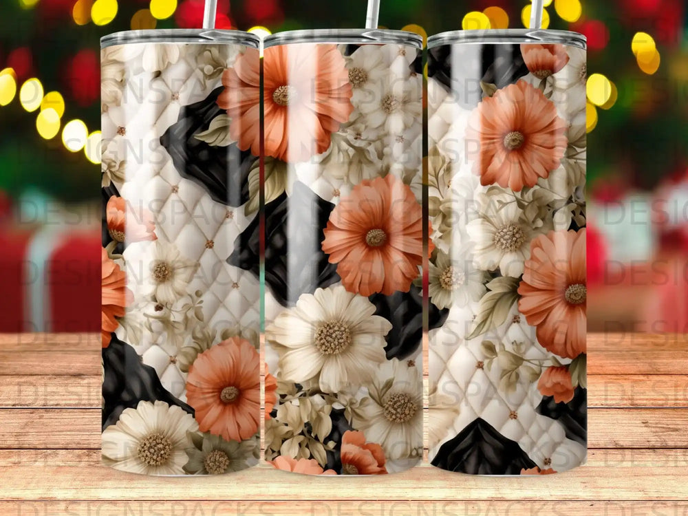 Floral pattern tumbler with cow print accents on a wooden surface.