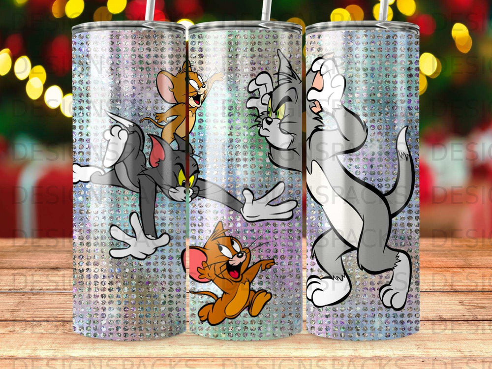 Tom and Jerry characters on a glittery tumbler with a wooden background.