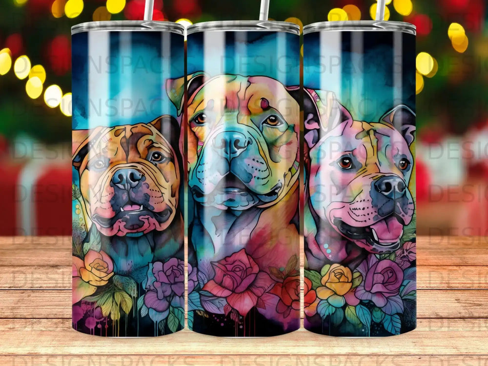 Three pit bulls with colorful floral accents on a wood background.