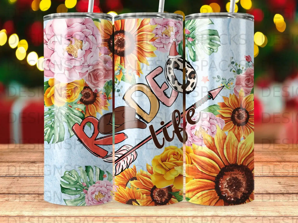 Tumbler with "Ride life" text, sunflowers, and floral designs.