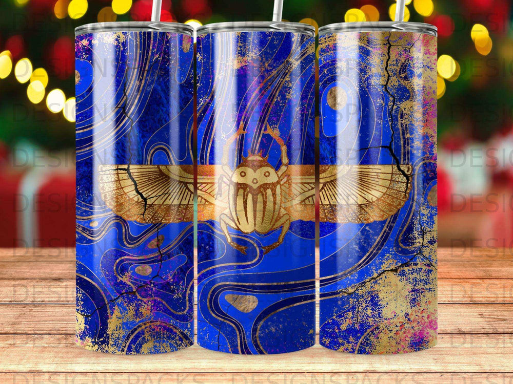 Blue tumbler with gold scarab beetle and swirling abstract design.