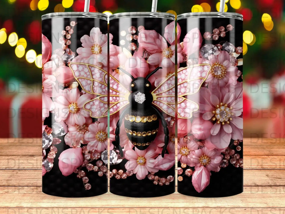 Black bee with pink flowers and jewels on a striped tumbler.