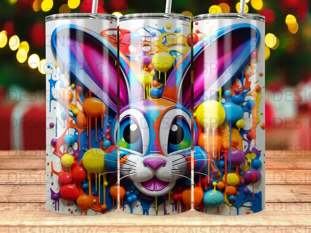 Colorful Easter bunny with paint splatters on a tumbler.