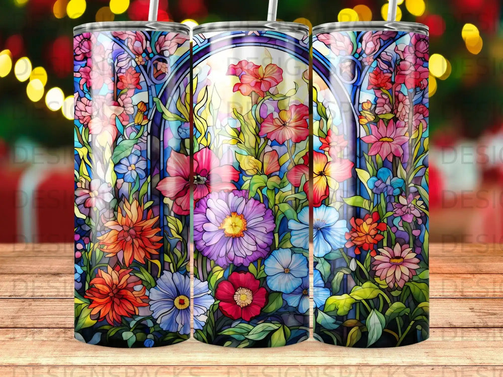 Stained glass design with vibrant floral patterns on three tumblers.