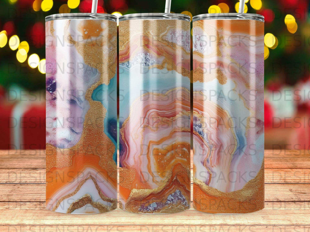 Three tumblers with marbled gold and purple designs.