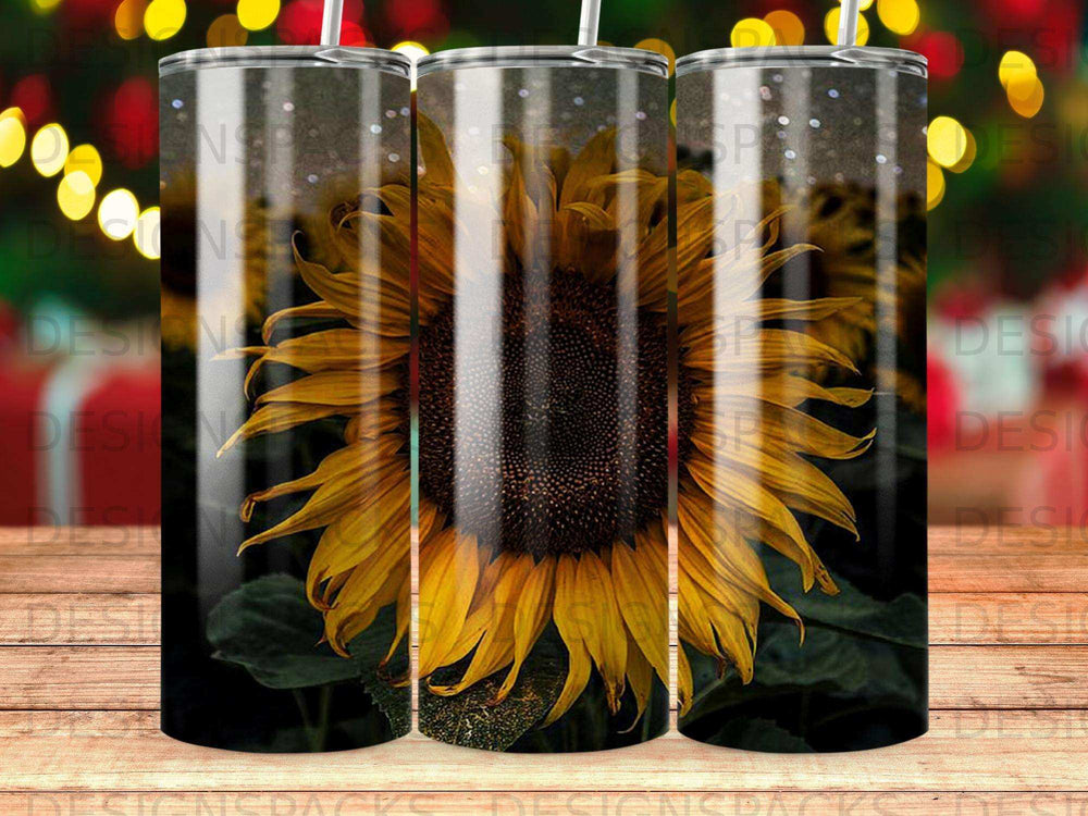 Three sunflowers with bokeh lights in the background.