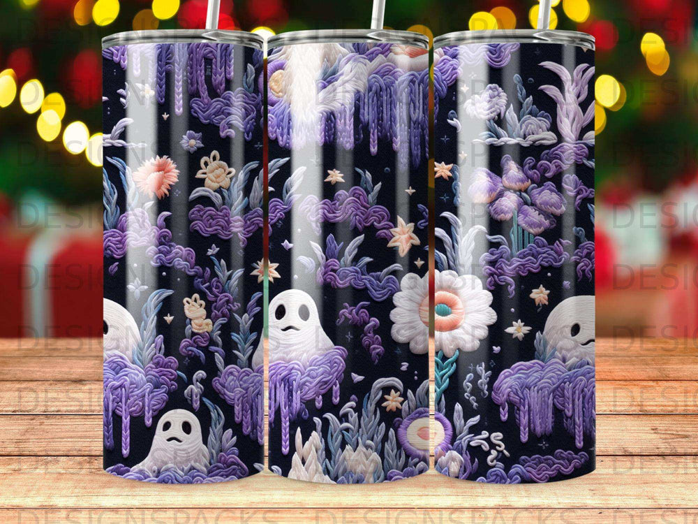 Three tumblers with purple ghostly figures and floral patterns.