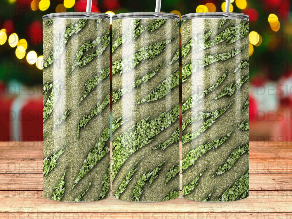 Glittery green paw print pattern on a tumbler with a straw.
