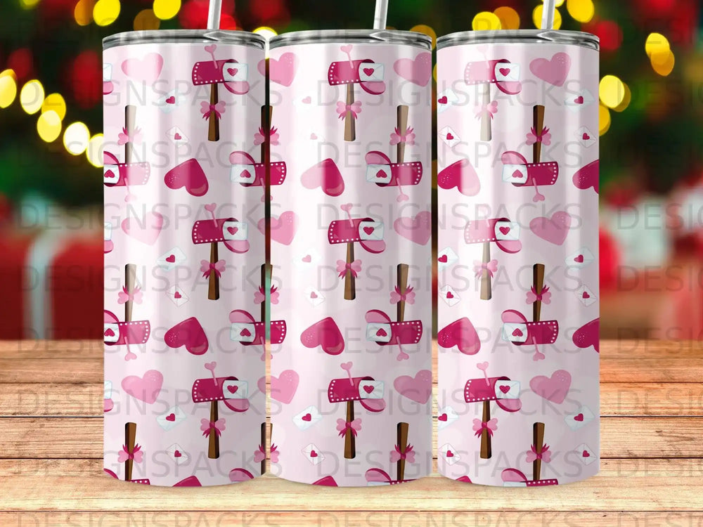 Pink tumbler with hearts, envelopes, and bows pattern.
