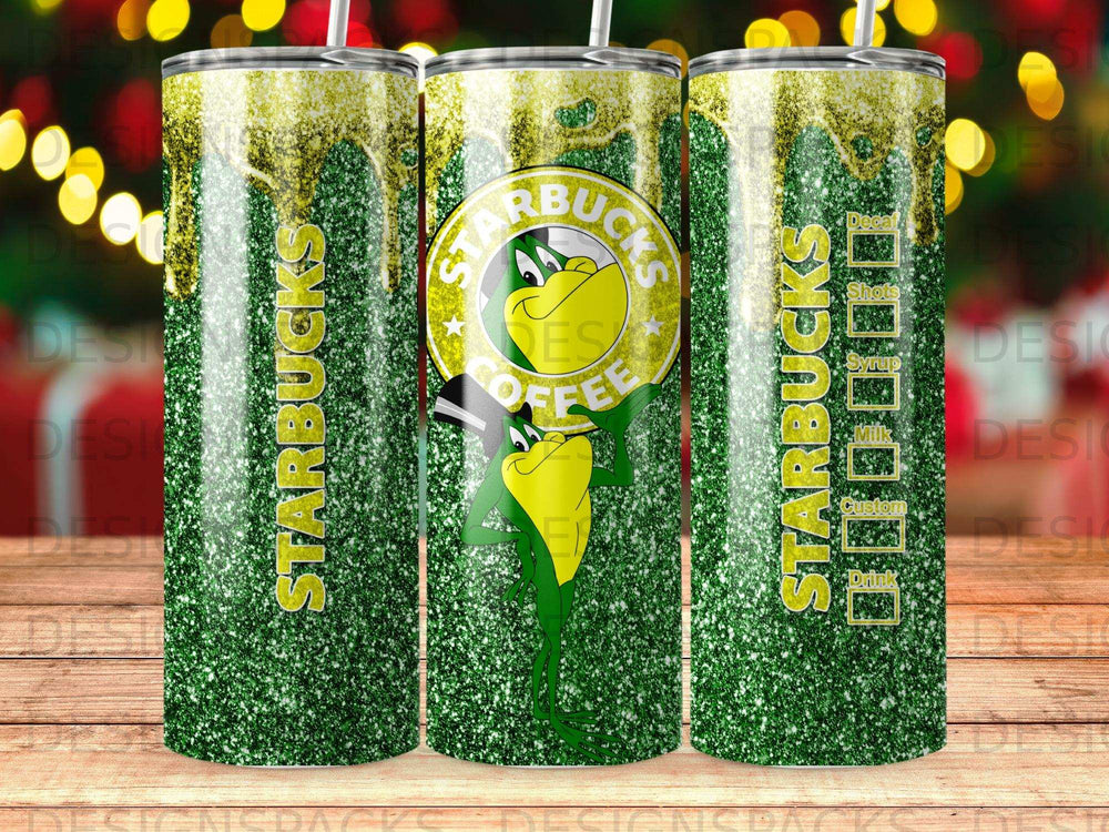 Starbucks tumbler with green glitter and a cartoon frog character.