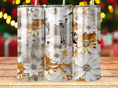 Silver butterflies and white and gold flowers adorn this tumbler.