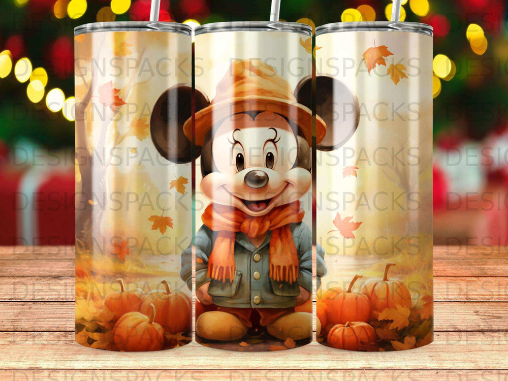 Mickey Mouse in a pumpkin patch wearing a scarf and hat.