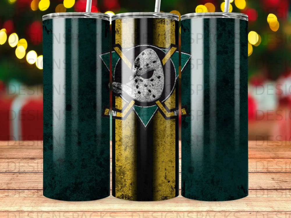 Green hockey puck with crossed hockey sticks and gold stripes on a tumbler.