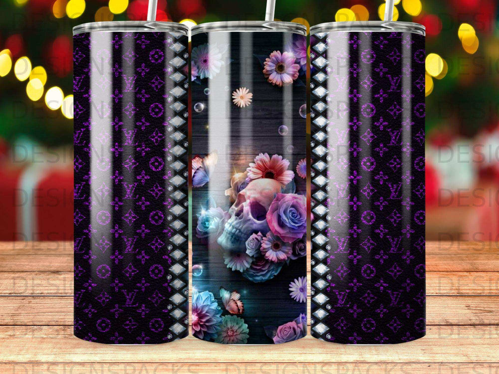 Skull and flowers design on a purple patterned tumbler.