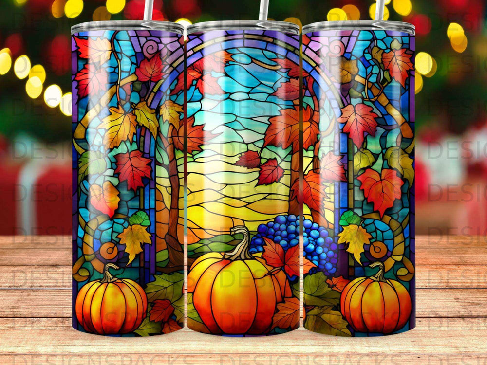 Stained glass tumbler with pumpkins, grapes, and autumn leaves.