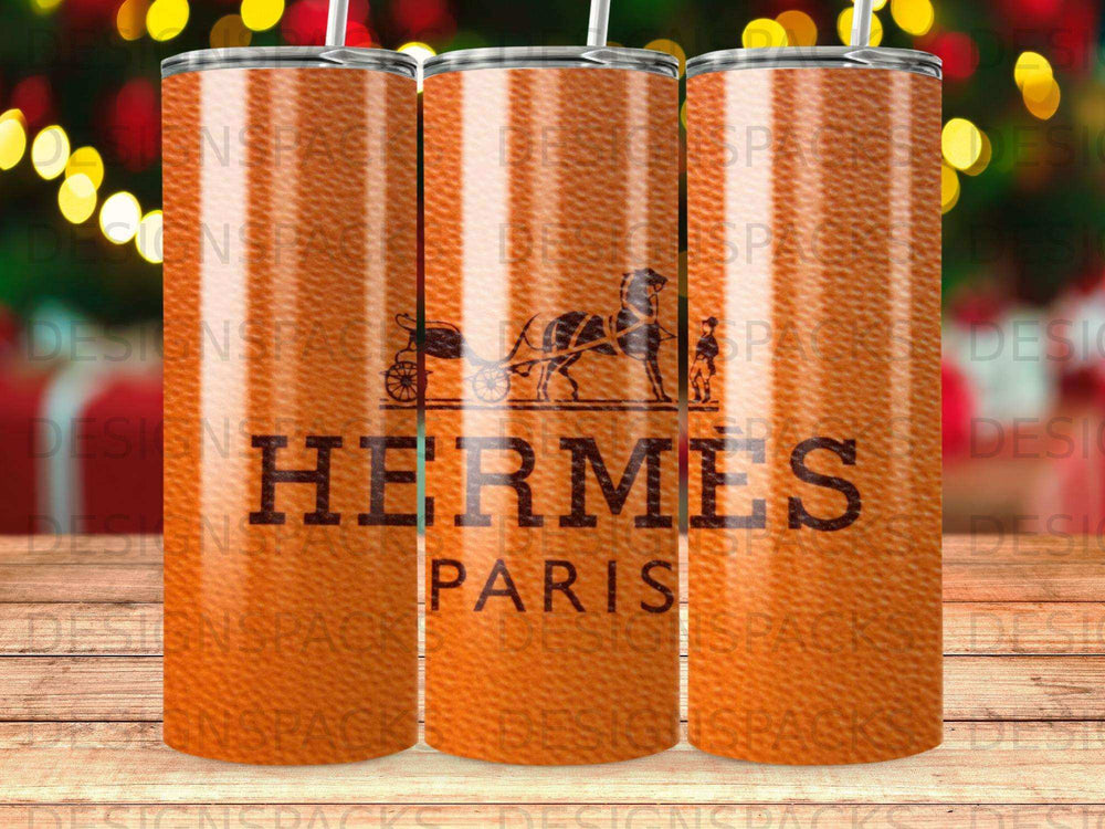 Hermes Paris logo on textured orange background tumbler.