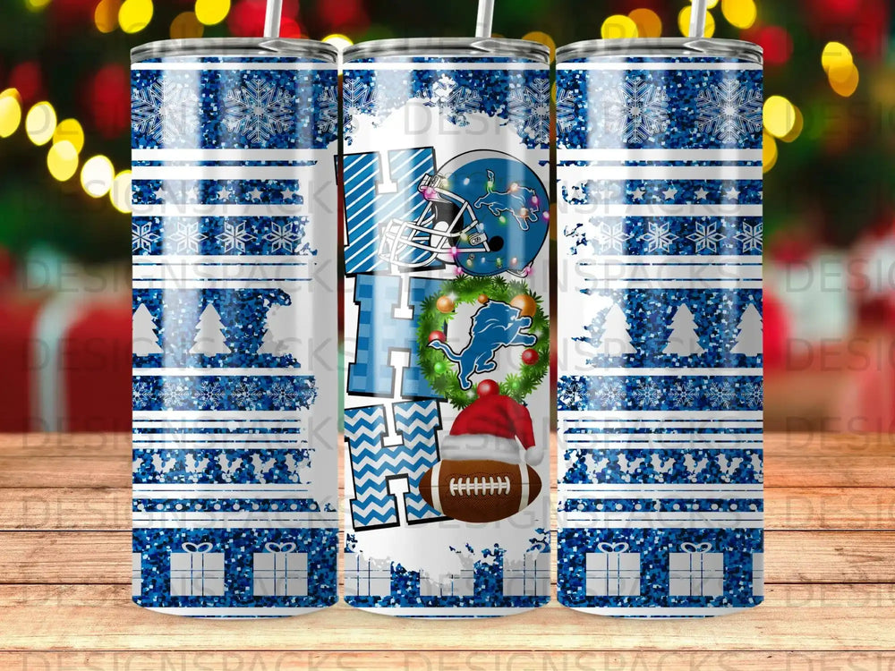 Detroit Lions themed tumbler with snowflakes and presents.