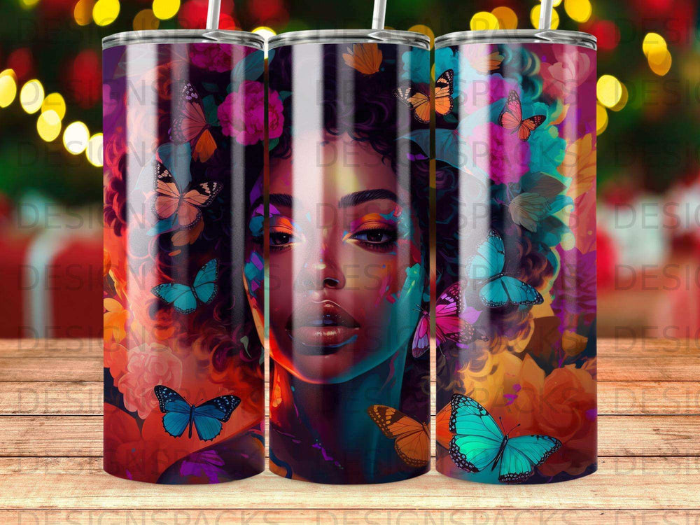 Woman's face with colorful butterflies and floral patterns on a tumbler.