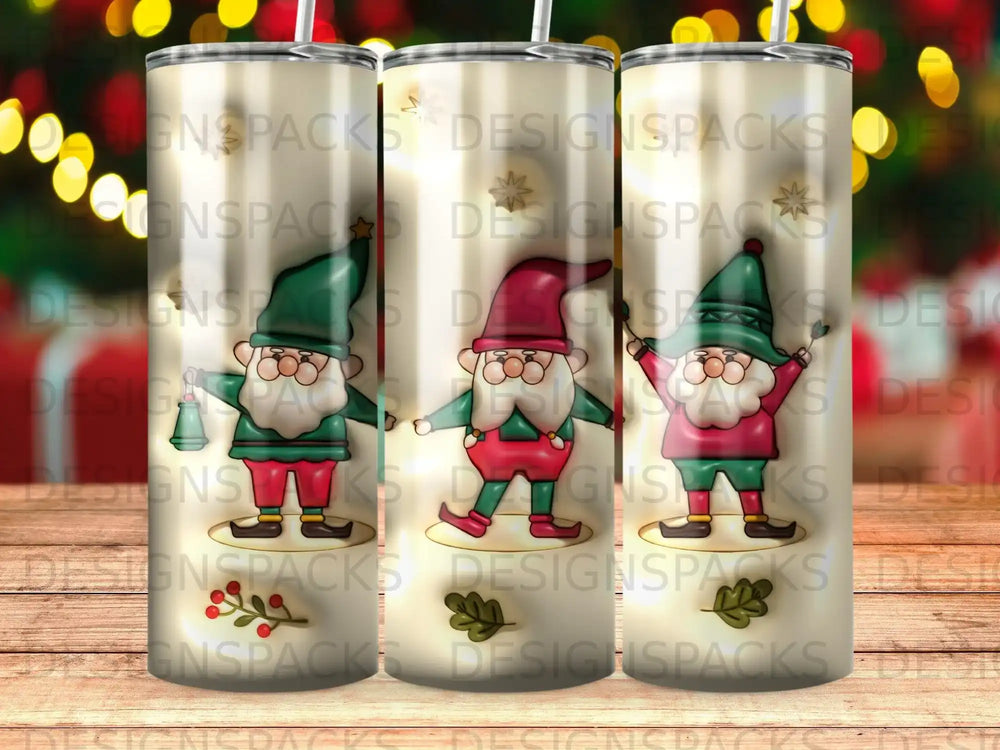 Three tumblers with Santa Claus designs and "DESIGNSPACKS" watermark.