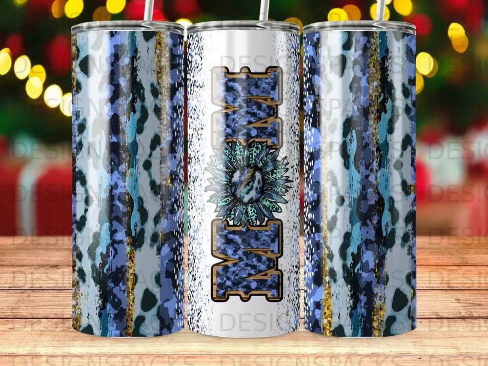 Tumbler with "MOM" in a floral pattern against a blue and gold marbled background.