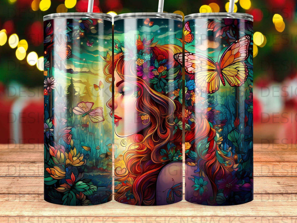 Tumbler with woman's profile surrounded by colorful butterflies and flowers.