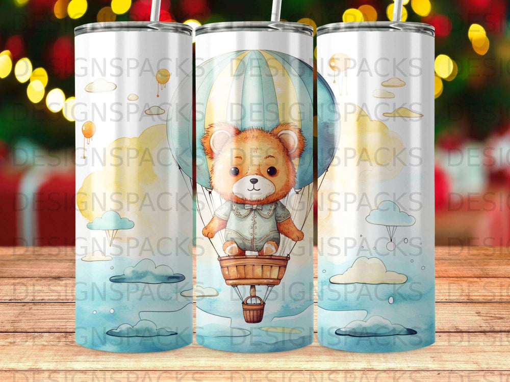 Bear in hot air balloon with colorful clouds and "DESIGNSPACKS" text.