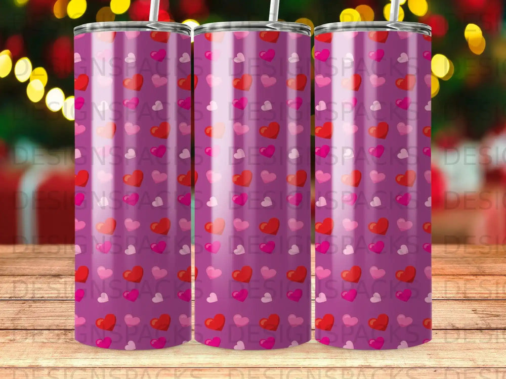 Tumbler with repeating pattern of pink and red hearts.