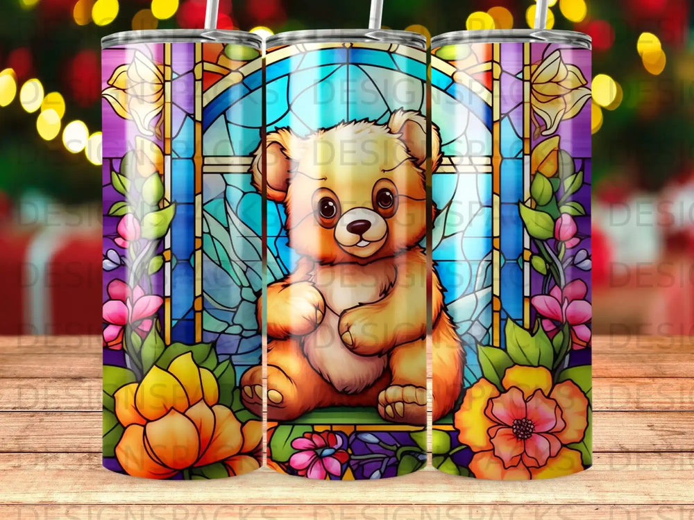 Teddy bear sits in front of stained glass window surrounded by flowers.