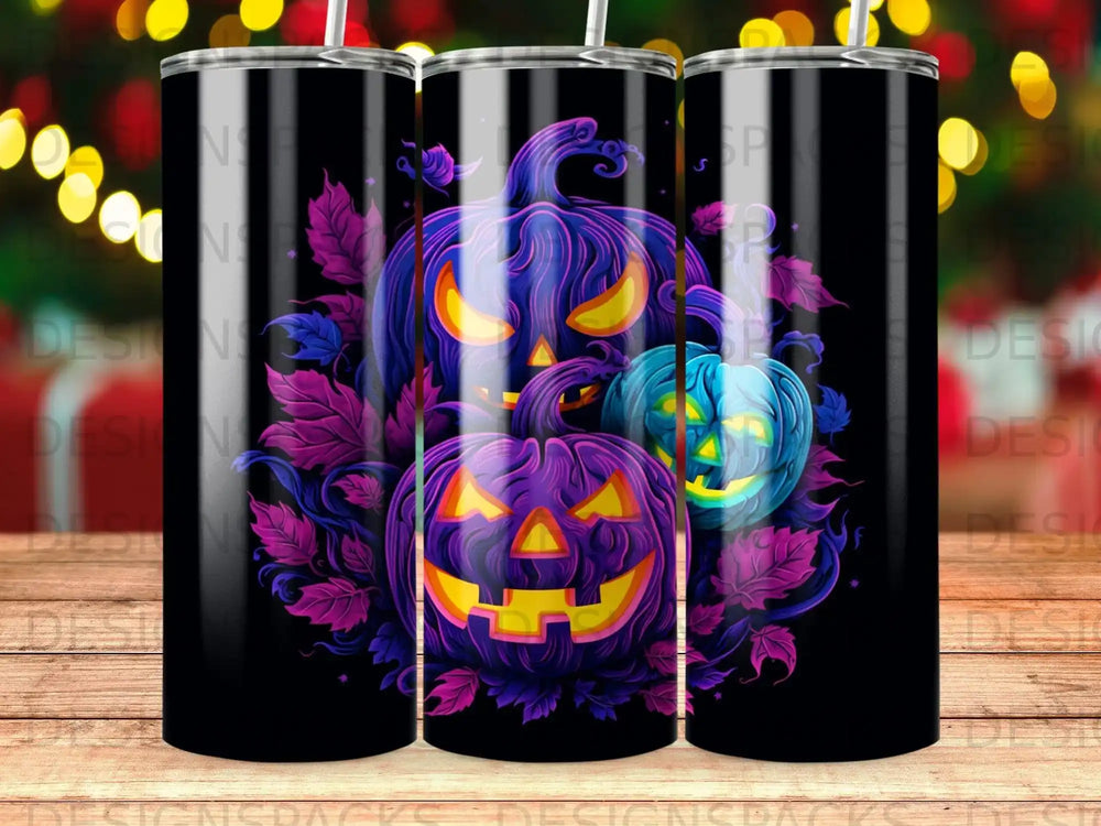 Three carved pumpkins with glowing faces surrounded by purple leaves.