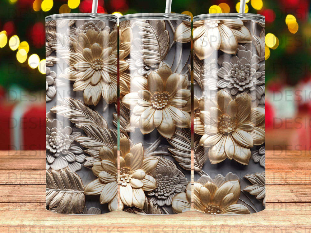 Three textured gold floral tumblers with festive bokeh background.