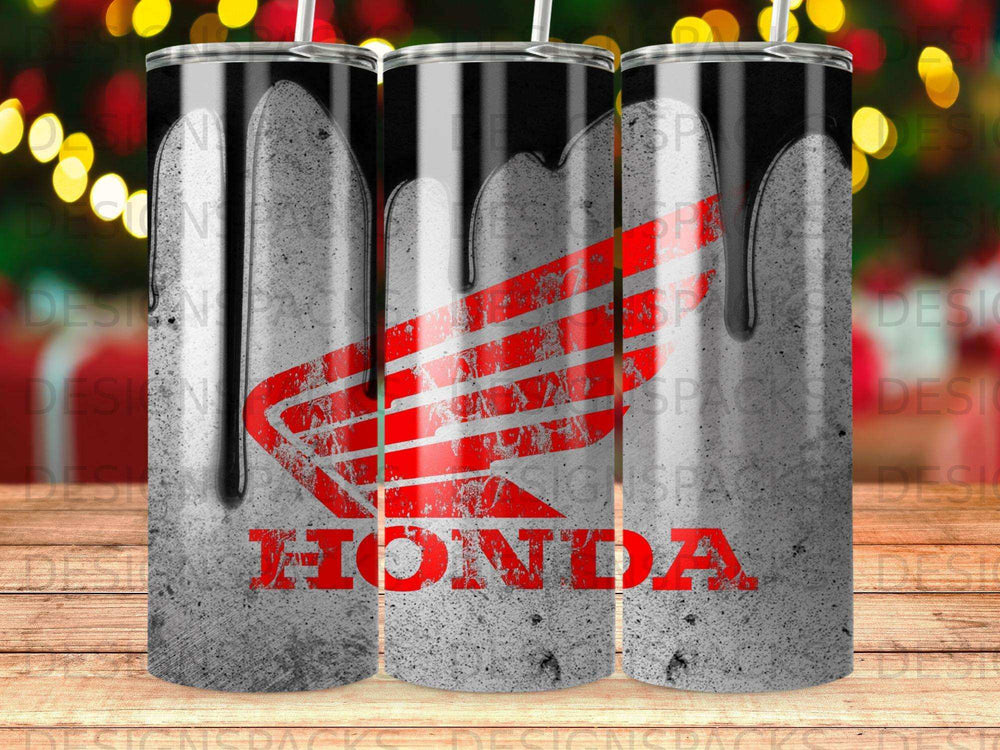 Red Honda logo dripping with black paint on a textured concrete tumbler.