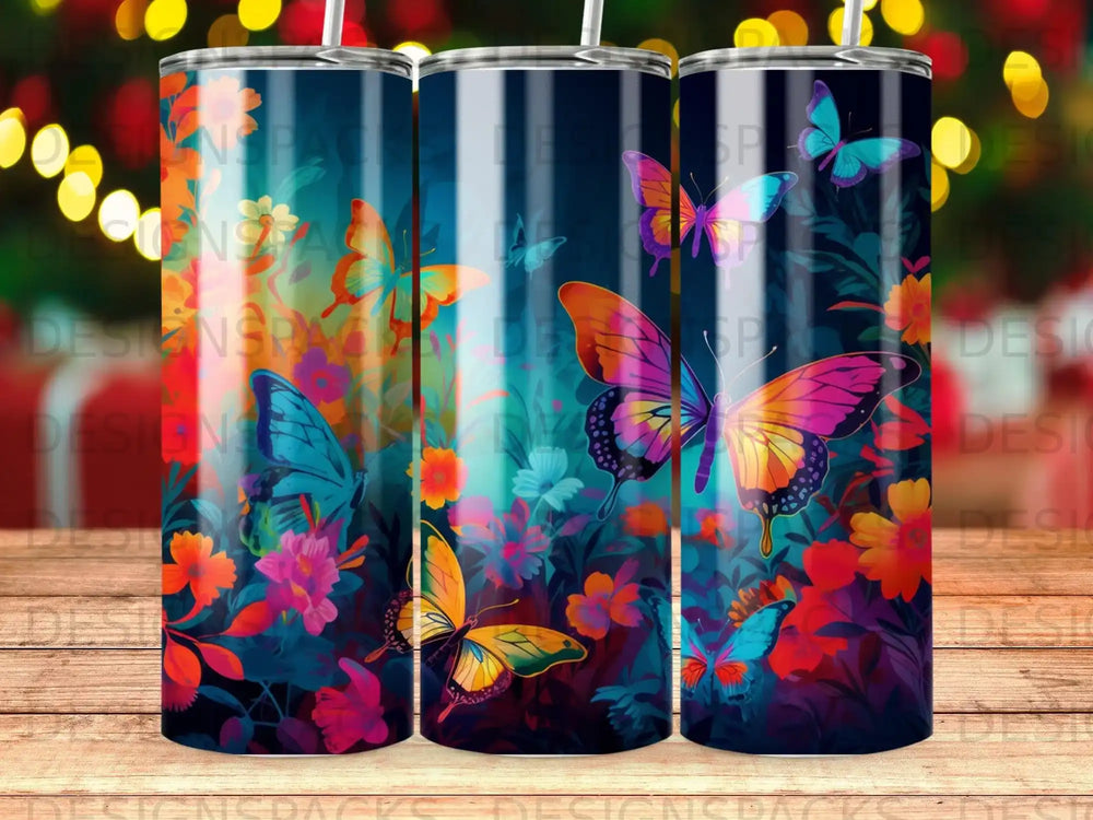 Blue and orange butterflies flutter among dark floral patterns on a tumbler.